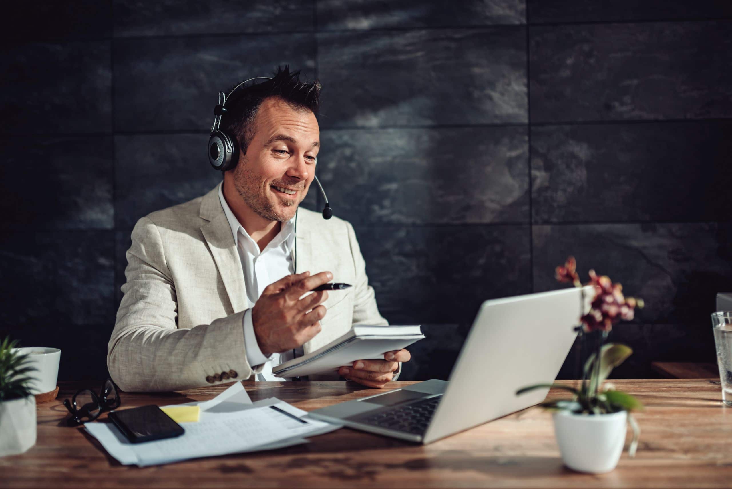 Businessman having online meeting in his office